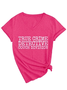 Detail of rose pink V-neck T-shirt with white True Crime Detective graphic and front tie knot