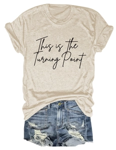 Detail of cream crew neck T-shirt with This is the Turning Point print and denim shorts