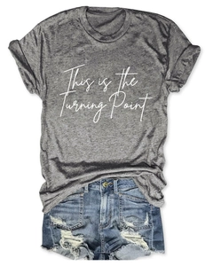 Flat lay of gray crew neck T-shirt with text and distressed blue denim shorts