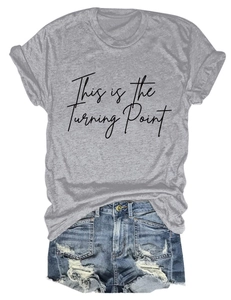 Detail of grey crewneck T-shirt with black text print and distressed denim shorts