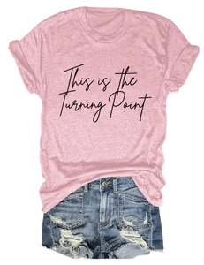 Pink cotton crewneck tee with black This is the Turning Point print and denim shorts