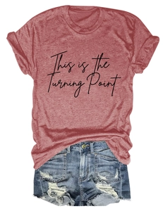 Detail of red T-shirt with 'This is the Turning Point' print and distressed denim shorts