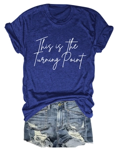 Detail of navy t-shirt with This is the Turning Point print and distressed denim shorts