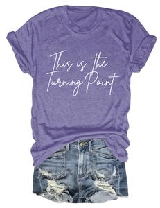 Detail showing a purple round neck T-shirt with white text and ripped denim shorts