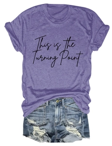 Flat lay of purple short sleeve t-shirt with script print and distressed denim shorts