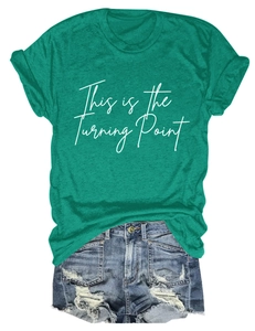 Detailed flat lay of green cotton T-shirt with white print and distressed denim shorts