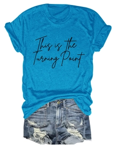 Detailed view of casual blue T-shirt with black 'This is the Turning Point' text print