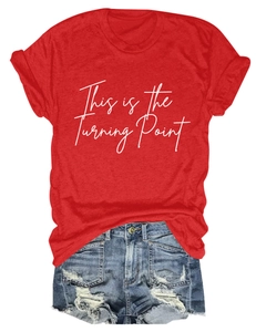 Detailed view of red cotton T-shirt with white text print and frayed blue denim shorts