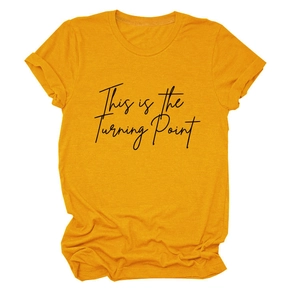 Detail of mustard yellow cotton T-shirt with black 'This is the Turning Point' print