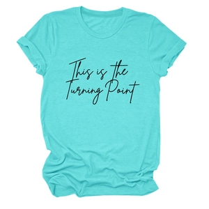 Detailed flat lay of mint green cotton t-shirt featuring This is the Turning Point text