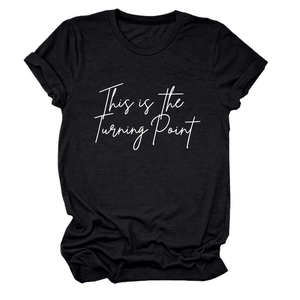 Detail of soft black cotton t-shirt featuring This is the Turning Point graphic print