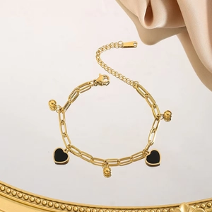 Golden stainless steel paperclip chain bracelet with heart pendants and satin decoration
