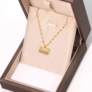 Elegant 18K gold-plated stainless steel lock pendant necklace displayed in a gift box