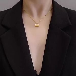 Minimalist 18K gold plated stainless steel rectangle lock pendant necklace on model