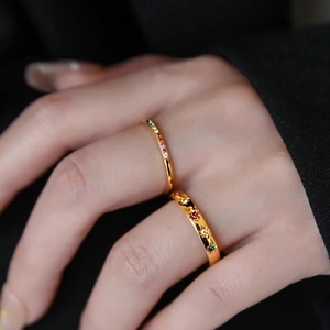 Rainbow CZ stone minimalist 18k gold plated titanium steel rings stacked on a model finger