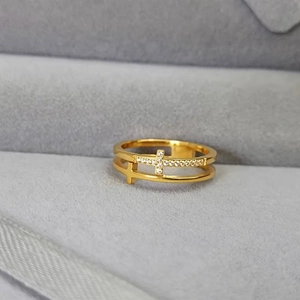 Double-layered gold titanium steel ring featuring hollow cross designs and white zircons