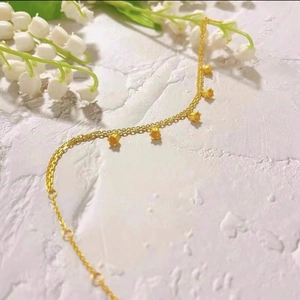 Elegant gold double-layered lily of the valley bracelet with five floral pendants