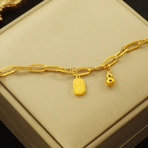 Golden double-layered gourd bracelet with lucky tag on champagne silk box