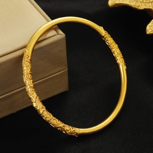 Vintage golden matte flower pattern bangle on black velvet with premium jewelry box