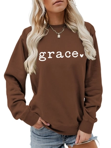 Detail of dark brown crewneck sweatshirt with grace text and heart print