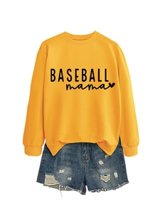 Detailed flat lay of a yellow Baseball Mama sweatshirt with distressed denim shorts
