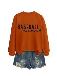 Flat lay of an orange Baseball Mama sweatshirt with blue distressed denim shorts