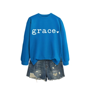 Women's blue crewneck sweatshirt with white grace heart print and denim shorts outfit