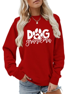 Detailed close-up of Dog Grandma graphic print on a red long sleeve crewneck sweatshirt