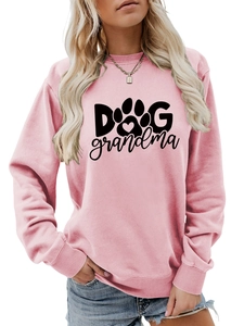 Detail of pink crewneck sweatshirt with black Dog Grandma text and heart paw print