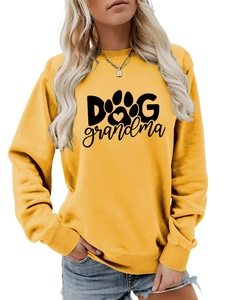 Close-up of Dog Grandma text and paw print on yellow cotton crewneck sweatshirt