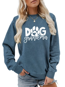 Close-up of Dog Grandma text and heart paw print on navy crewneck sweatshirt