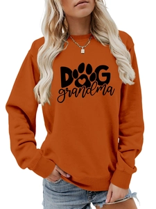 Detail of Dog Grandma logo with heart and paw print on orange long sleeve sweatshirt