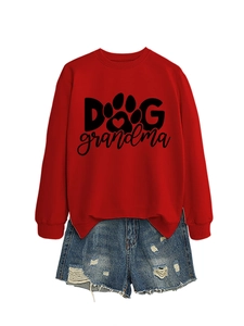 Flat lay of red Dog Grandma sweatshirt with paw print and distressed denim shorts