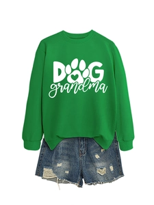 Detail of green long-sleeved crewneck sweatshirt with Dog Grandma print and paw graphic