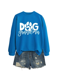 Detail of royal blue Dog Grandma sweatshirt with heart paw print and ripped denim shorts