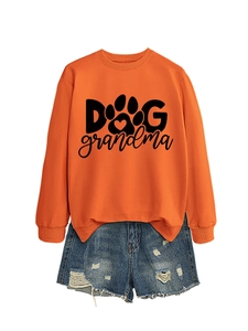 Orange Dog Grandma sweatshirt with blue ripped denim shorts layout on white background