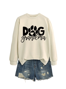 Detail of Dog Grandma sweatshirt with heart paw print paired with ripped denim shorts