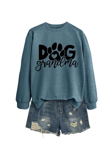 Flat lay of blue-grey Dog Grandma crewneck sweatshirt with distressed denim shorts