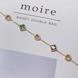 Elegant gold titanium bracelet featuring colorful heart and square zircon gemstones