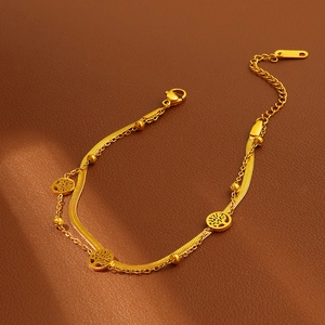 Gold double-layered snake chain bracelet with Tree of Life charms on brown leather