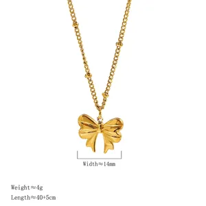 Vintage golden bow pendant necklace in stainless steel with textured knot and bead chain