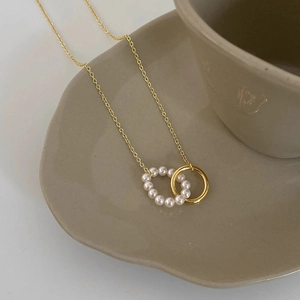 18k gold plated titanium necklace with interlocking pearl ring and metal circle pendant