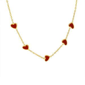 Gold necklace with five red heart-shaped enamel pendants on a delicate cross chain
