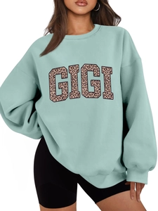 Detail view of the mint green GIGI leopard print sweatshirt with cozy ribbed texture