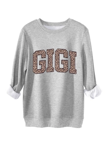 Detail of grey fleece sweatshirt lining with GIGI leopard print and ribbed cuffs
