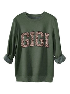 Detail of warm grey fleece lining and ribbed neckline on dark green GIGI sweatshirt