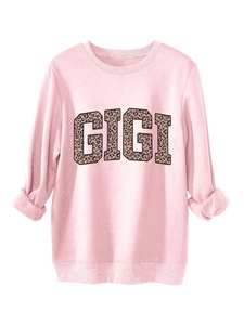 Pink sweatshirt featuring ribbed cuffs and GIGI leopard print letters on soft fabric