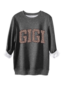 Detail of grey sweatshirt with GIGI leopard print and warm white fleece lining