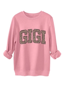 Detailed view of pink sweatshirt with GIGI leopard print lettering and ribbed cuffs