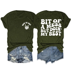 Detailed back and front view of olive green graphic t-shirt and ripped denim shorts